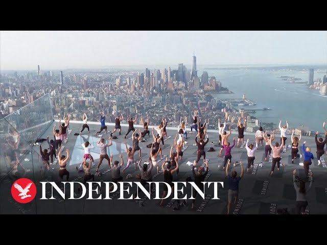 New Yorkers practice yoga on top of 100-storey skyscraper in Manhattan